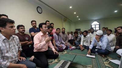 Imran Hilal Khan runs Helping Hands each Friday, a support group that aims to help people improve their CVs and communications skills as they seek employment. Satish Kumar / The National