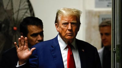 Donald Trump gestures as he walks back to the courtroom after a break in his trial in Manhattan, New York City, on May 6. AFP