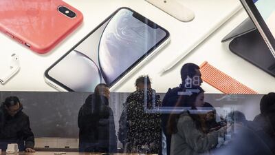 Shoppers browse inside an Apple store in Shanghai. Apple reported a revenue of $84.3bn in the first quarter of 2019, a 5 per cent year-on-year decline. Bloomberg