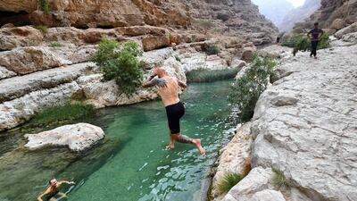 A tourist jumps in the water at Wadi Shab in the Sharqiyah region near Muscat. AFP