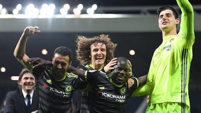 From left: Antonio Conte, Pedro, David Luiz, N'Golo Kante and Thibaut Courtois of Chelsea celebrate winning the league. Laurence Griffiths / Getty Images