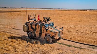 A Turkish military vehicle takes part in joint patrol with the US military convoy on the outskirts of the Syrian border town Tel Abyad on September 24, 2019. AFP
