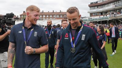 England's Ben Stokes, left, celebrates with supporters at the Oval in London one day after his team won the Cricket World Cup. AP Photo