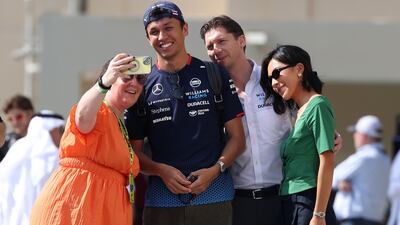 Williams driver Alexander Albon poses for a selfie ahead of qualifying. Chris Whiteoak / The National