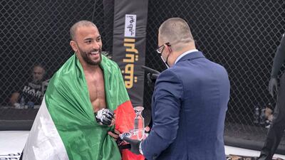 Yousef Al Husani receives his award from Fouad Darwish. Courtesy UAE Warriors