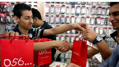 Wataniya Telecom's debut on the Palestine Exchange was cheered by investors. Saif Dahlah / AFP