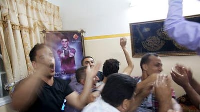 Family members and friends at the family home of Mohammed Assaf in a refugee camp Khan Younis, Gaza , celebrate as Mohammed Assaf is announced the winner. Heidi Levine/Sipa Press