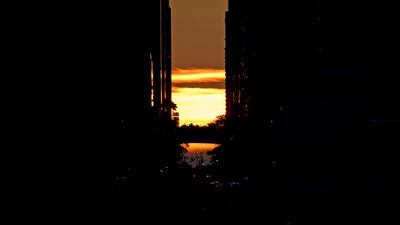 The sun sets behind 42nd Street in Manhattan during a power outage in New York City. AFP