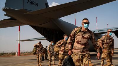French soldiers from Operation Barkhane disembark from a US Air Force C130 cargo plane before transferring back to their bases in France. AP