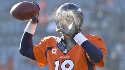 It wasn't snowing in Denver, Colorado where the Denver Broncos defeated the Tennessee Titans 51-28, but it was cold enough for Peyton Manning to see his breath. Jack Dempsey / AP