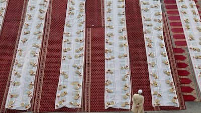 A resident waits to break his fast in the parking area near the Al Ghubaiba Bus Station in Bur Dubai. Pawan Singh / The National