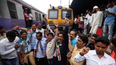 Protesters block a railway track in reaction to record petrol and diesel prices in Mumbai, India. REUTERS/Francis Mascarenhas