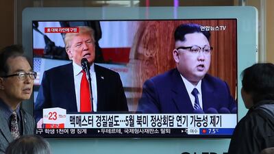 A TV screen shows North Korean leader Kim Jong Un, right, and U.S. President Donald Trump during a news programme at Seoul Railway Station, South Korea, on Saturday, March 17, 2018. Ahn Young-joon /AP Photo