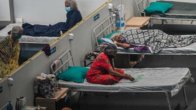 Patients rest inside a Covid-19 isolation centre in Navi Mumbai, India. AFP