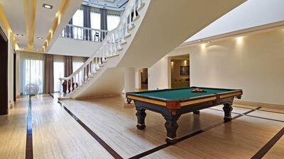 The 19,618-square-foot plot, luxurious six-bedroom villa overlooks a lake and the Montgomerie Golf Course.