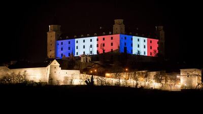 Bratislava Castle is lit in red, white and blue, on November 14, 2015, as Slovakians express their solidarity with France. Vladimir Simicek/AFP Photo