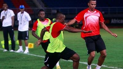Equatorial Guinea’s Ben Konate, left, and Thierry Fidjeu train at Bata Stadium, which will host the opening ceremony.