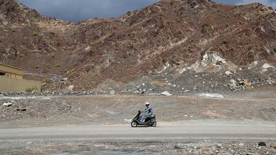 The National's best pictures of the year: A person on his scooter during cloudy weather near Masafi in Fujairah. Pawan Singh/The National