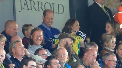Prince George, Prince William, and Catherine, Duchess of Cambridge are seen in the stands. Getty Images
