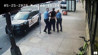 This image from video shows Minneapolis police Officers Thomas Lane, left and J. Alexander Kueng, right, escorting George Floyd, centre, to a police vehicle in Minneapolis, on May 25, 2020. Court TV via AP