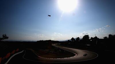 Fernando Alonso of Spain drives his Ferrari during the Japanese Formula One Grand Prix at Suzuka. Clive Mason / Getty Images