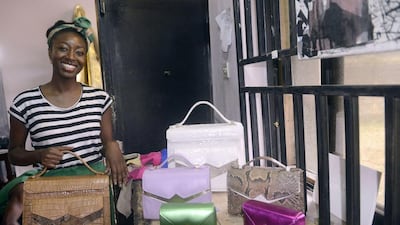 Handbag designer Zainab Ashadu poses with her creations at her Lagos workshop. Pius Utomi Ekpei / AFP photo