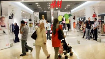 Shoppers wander into H&M at City Stars Mall, in Cairo, Egypt.