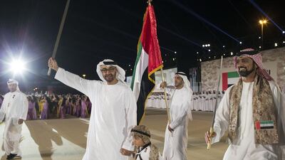 Sheikh Mohammed bin Zayed, Crown Prince of Abu Dhabi and Deputy Supreme Commander of the Armed Forces, with Sheikh Tahnoon bin Mohammed Al Nahyan and Sheikh Ammar bin Humaid Al Nuaimi, Crown Prince of Ajman, dance during the UAE’s 43rd National Day celebrations at the Abu Dhabi National Exhibition Centre. Ryan Carter / Crown Prince Court – Abu Dhabi