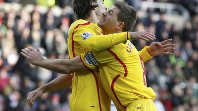Liverpool's Lazar Markovic, left celebrates his goal with teammate Steven Gerrard. Reuters