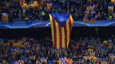 Barcelona supporters hold pro-independence Catalan flags during the Champions League match on Wednesday night at the Camp Nou. David Ramos / Getty Images