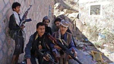 Yemeni armed men from the Popular Resistance Committees loyal to the country's exiled president sit under the shade on a street in the city of Taez during ongoing clashes with Shiite Houthi rebels, on May 3, 2015. Abdel Rahman Abdallah/STR/AFP Photo