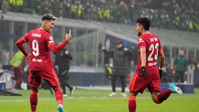 Liverpool's Roberto Firmino celebrates after scoring his side's opener. AP