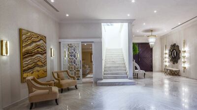 The house has two central stairways and a private elevator.