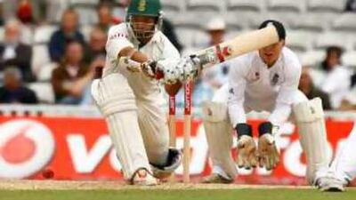 South Africa's Ashwell Prince tries to sweep England's Monty Panesar during the fourth day at the Oval.
