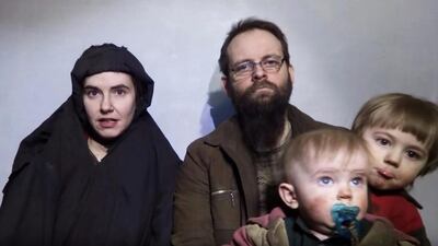 A still image from a video posted by the Taliban on social media on December 19, 2016 shows American Caitlan Coleman, left, speaking next to her Canadian husband, Joshua Boyle, and their two sons who were born in captivity. Taliban / Social media via Reuters