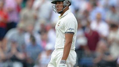 Australia's Usman Khawaja walks off after being given out during play on the first day of the third Ashes Test at Old Trafford. Andrew Yates / AFP