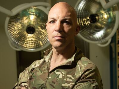 Lt Col Benjamin Caesar used his experience of parenthood to settle a baby passed to US Marines. Photo: Ministry of Defence