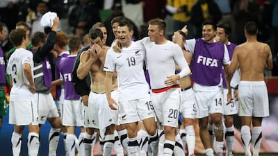 Tommy Smith and Chris Wood of New Zealand celebrate with team mates after a draw in the 2010 FIFA World Cup South Africa Group F match between Italy and New Zealand at the Mbombela Stadium on June 20, 2010 in Nelspruit. Streeter Lecka / Getty Images