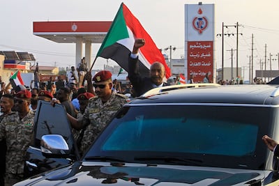 Sudan's army chief, Gen Abdel Fattah Al Burhan, greets supporters in Port Sudan. AFP