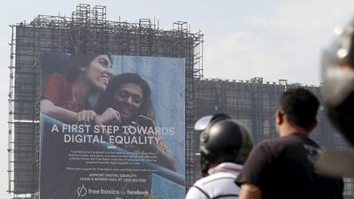 Motorists ride past a billboard advertising Facebook's Free Basics initiative in Mumbai last year. (Danish Siddiqui / Reuters0