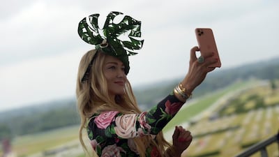 Racegoers take selfies during Royal Ascot 2021 at Ascot Racecourse in Ascot, England. Getty Images