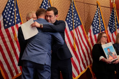 Actor and director Joseph Gordon-Levitt embraces Representative Brandon Guffey at the media conference. Getty Images