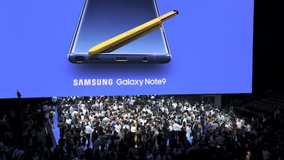 Media gather around as Samsung unveils the Galaxy Note 9 during an Unpacked event at the Barclays Center in the New York City borough of Brooklyn August 9, 2018 (Photo by TIMOTHY A. CLARY / AFP)