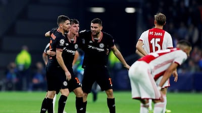 Mason Mount celebrates with Jorginho and Mateo Kovacic after the match in Amsterdam. Reuters