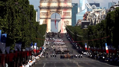 Alpha jets from the French Air Force Patrouille de France fly over the Champs-Elysees. Gonzalo Fuentes / Reuters