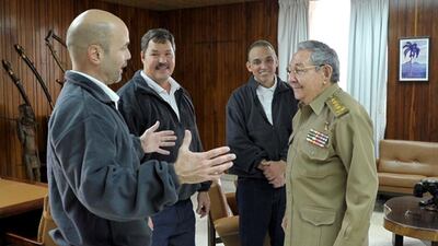 Cuban president Raul Castro greets Gerardo Hernandez, left, Ramon Labanino, centre, and Antonio Guerrero in Havana yesterday upon their release from the United States. The trio, who were behind bars in the US for more than 15 years, were part of a prisoner-exchange deal. AFP
