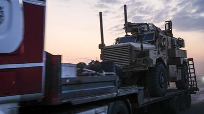 A convoy of U.S. armored military vehicles leave Syria on a road to Iraq. Getty Images