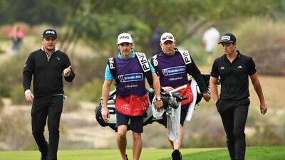 Eddie Pepperell of England, left, and Viktor Hovland of Norway walk on the 14th fairway. Getty Images
