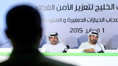 Mohamed Bin Obaid Al Mazrowei, right, chairman of the Arab Authority for Agricultural Investment and Development, and Mohammed Al Nuaimi of the Abu Dhabi Food Control Authority discuss the March 2 forum that would tackle food security and supporting small scale farmers. Delores Johnson / The National