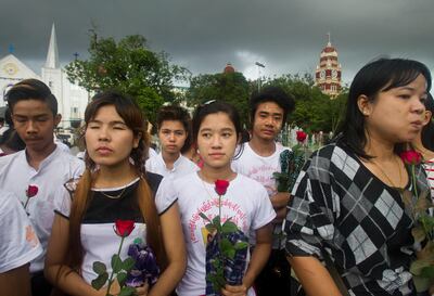 Protesters holding roses in front of the city hall in Yangon, Myanmar on September 3, 2017. AP Photo
